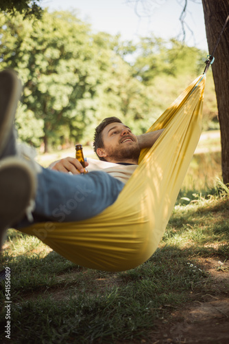 Boy relaxing on a hammock in the park