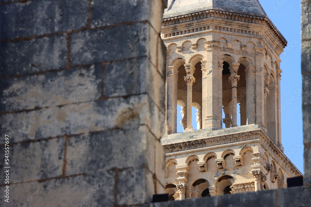 Saint Domnius tower seen through The Silver Gate. Historical landmarks in Split, Croatia. Selective focus.