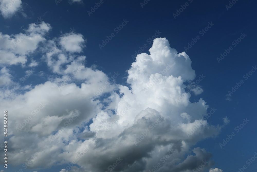 Beautiful fluffy clouds in the sky, natural background Beautiful fluffy clouds in the sky, natural background