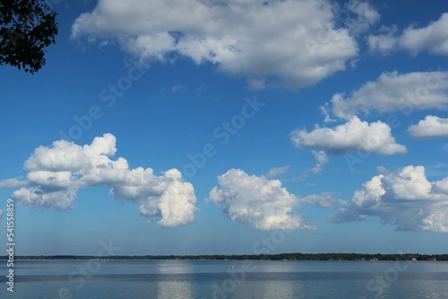 Beautiful clouds in blue sky over the river in Florida nature © natalya2015