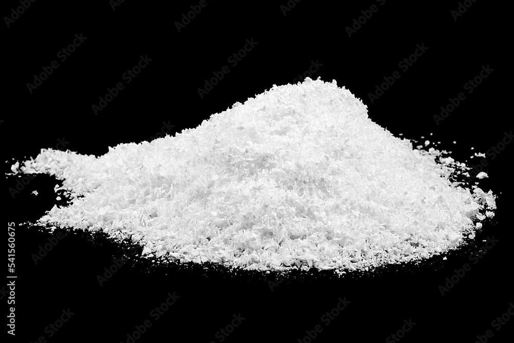 Heap of white snow isolated on a black background