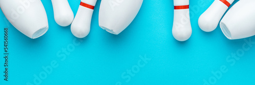 Fototapet Minimalist photo of bowling pins over turquoise blue background