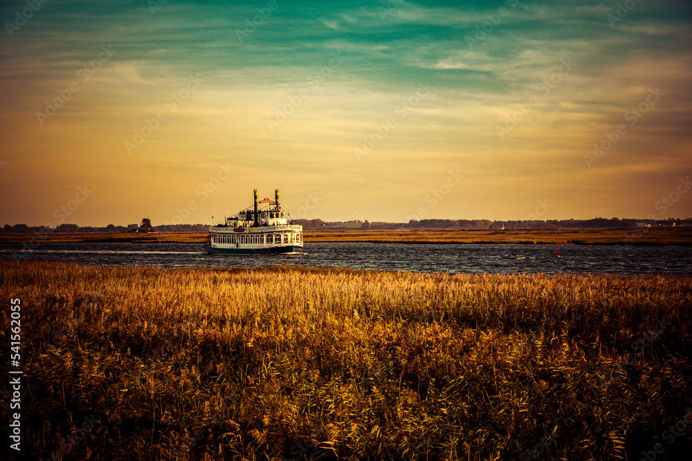 Fototapeta premium sunset over a steam boat