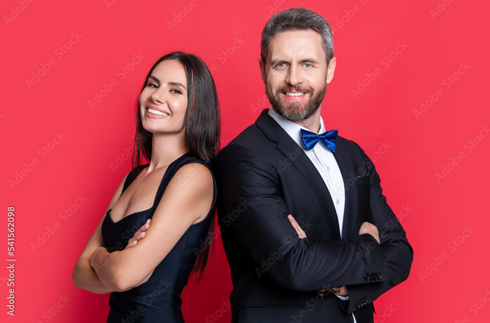 studio shot of glad formal tuxedo couple. elegant couple wear formal tuxedo. formal tuxedo couple studio shot of glad formal tuxedo couple. elegant couple wear formal tuxedo. formal tuxedo couple