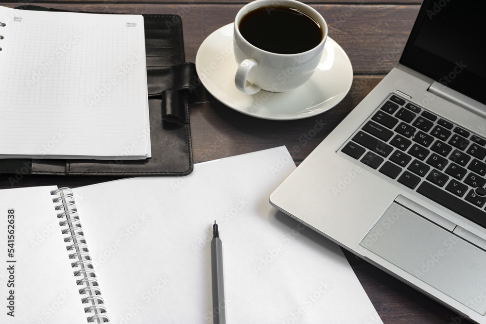 Business online. A laptop computer and a cup of coffee. Business online. A laptop computer and a cup of coffee.
