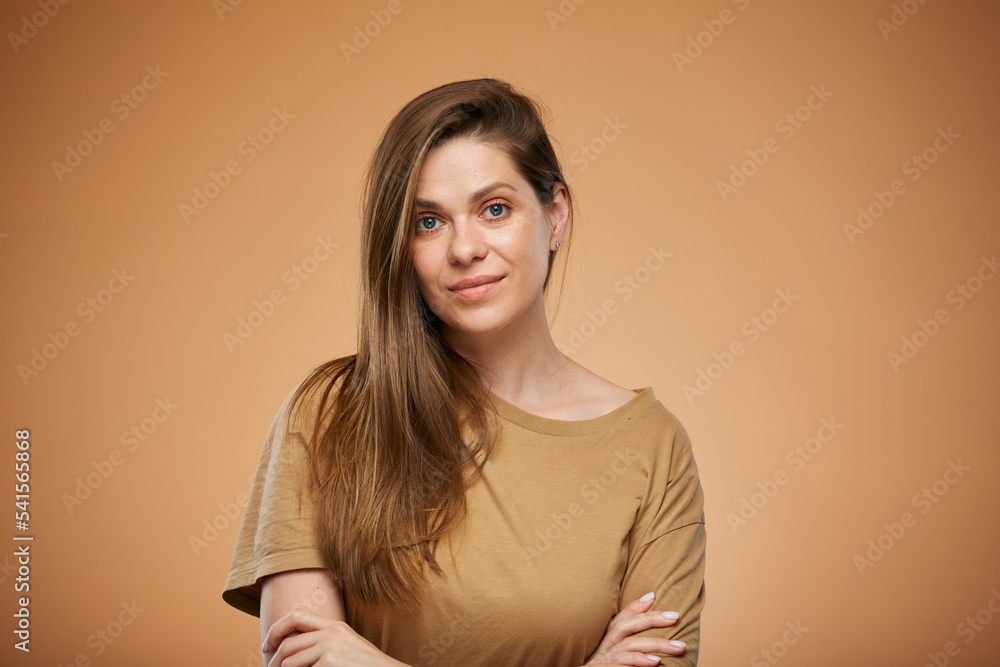 Obraz premium Smiling woman with long hair in brown home male shirt. Isolated female portrait.