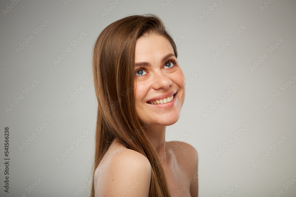 Close up beauty style portrait of young woman with bare shoulders looking at side away. Isolated studio advertising portrait. Close up beauty style portrait of young woman with bare shoulders looking at side away. Isolated studio advertising portrait.