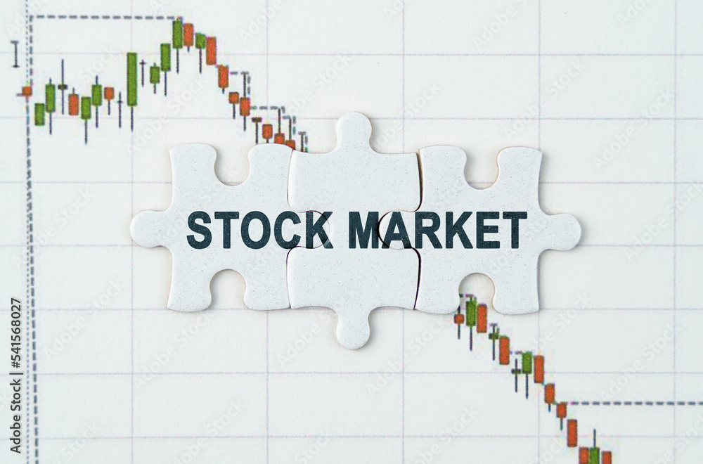 On the quotes chart there are puzzles with the inscription - STOCK MARKET On the quotes chart there are puzzles with the inscription - STOCK MARKET