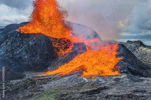 Volcanic activity by strong lava flow with fountain. active volcano in Iceland erupting. Volcanic landscape on the reykjanes peninsula. low level of steam rising from the volcanic crater