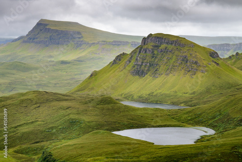 Quraing mountain pass and hiking path views  in mid summer Trotternish Isle of Skye Highlands of Scotland UK.