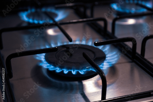 Gas burning with blue flames from a kitchen gas stove. Europe gas crisis.