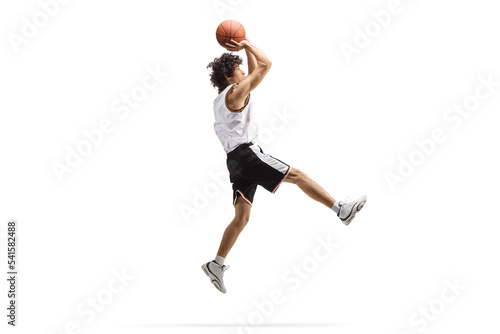 Athlete jumping and shooting a basketball