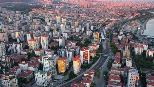 Highrise blocks of flats in Istanbul in Turkey on a sunny day. Skyline of residential buildings. Aerial Bostanci Neighborhood. Multistory buildings divided into crowded apartments. 
 photo