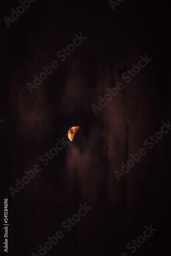 the moon lights up the darkness of the night 