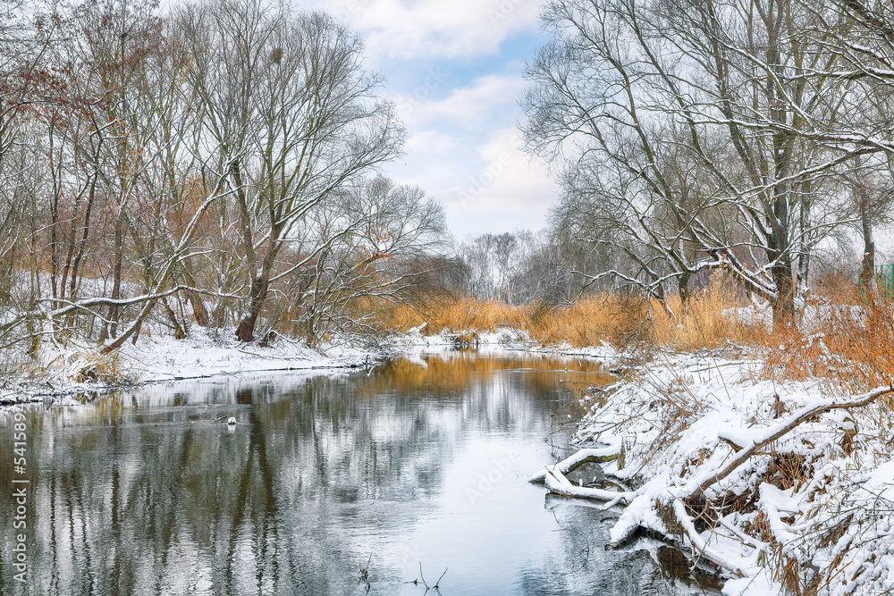 Winter landscape by a river in the sunset. Winter landscape by a river in the sunset.