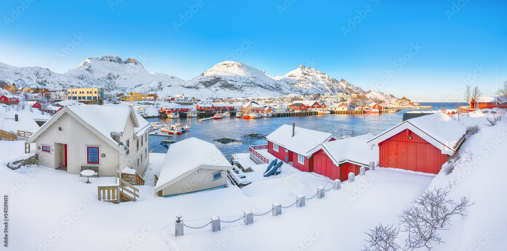 Splendid morning seascape of Norwegian sea and cityscape of Sorvagen town.
