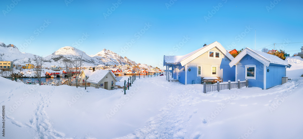 Outstanding morning seascape of Norwegian sea and cityscape of Sorvagen town.