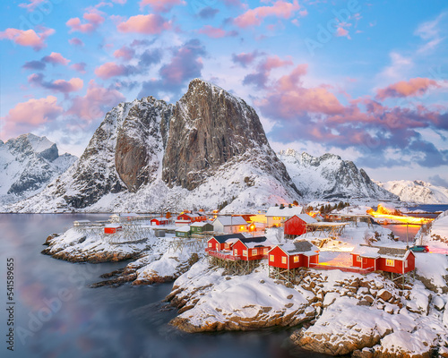 Amazing sunset winter view on Hamnoy village and Festhaeltinden mountain on background. photo