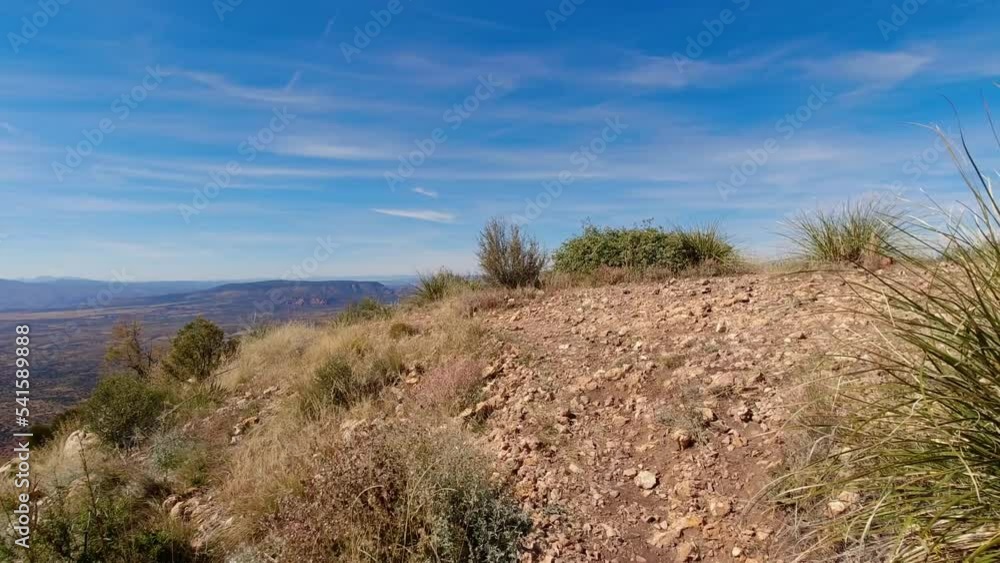 Mountaintop viewpoint with the desert landscape below. Mountaintop viewpoint with the desert landscape below.