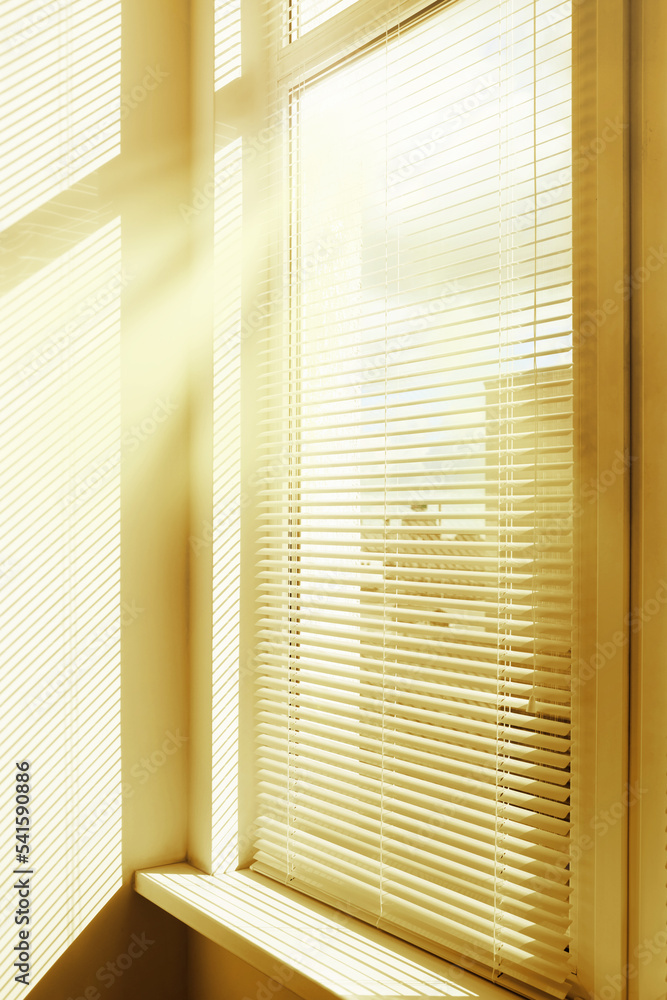 Stylish window with horizontal blinds in room Stylish window with horizontal blinds in room