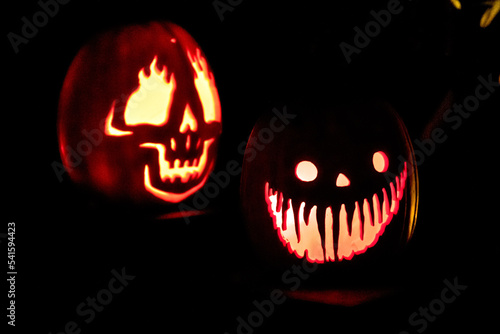 Carved Jack-o-lanterns lit at night for Halloween 