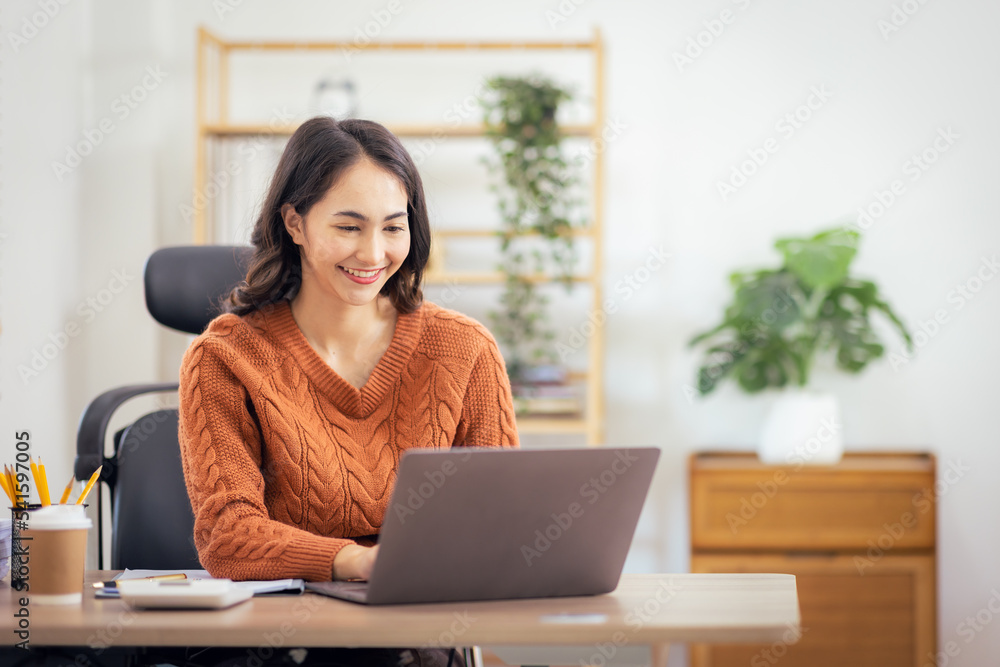 Freelancer Asian businesswoman Accounting work at home using calculating income-expenditure and analyzing real estate investment data report Financial and Documents tax systems concept. Freelancer Asian businesswoman Accounting work at home using calculating income-expenditure and analyzing real estate investment data report Financial and Documents tax systems concept.