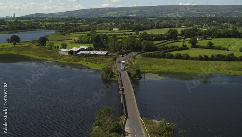 Aerial flyover view of bridge over River Erne / Enniskillen, Northern Ireland photo