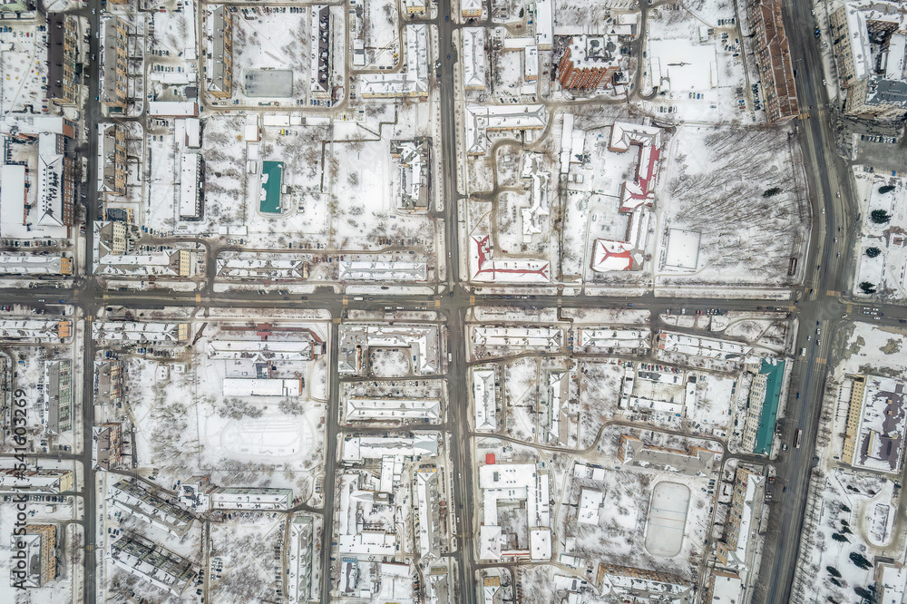 City panorama from the height of the drone flight. Residential area of brick houses in the winter. Aerial view. Nizhny Tagil, Russia