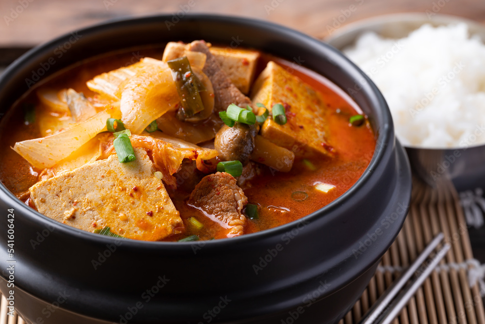 Korean food, Kimchi soup with tofu and pork in Korean stone pot