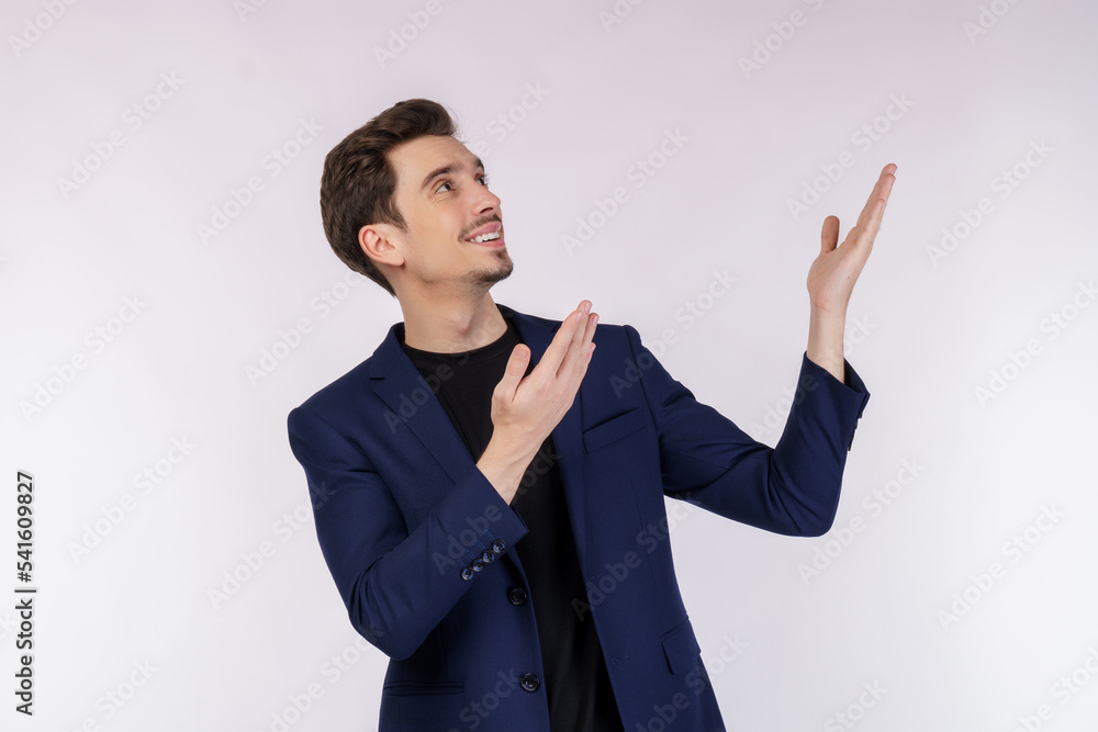 Portrait of happy smiling young businessman presenting and showing your text or product isolated on white background Portrait of happy smiling young businessman presenting and showing your text or product isolated on white background