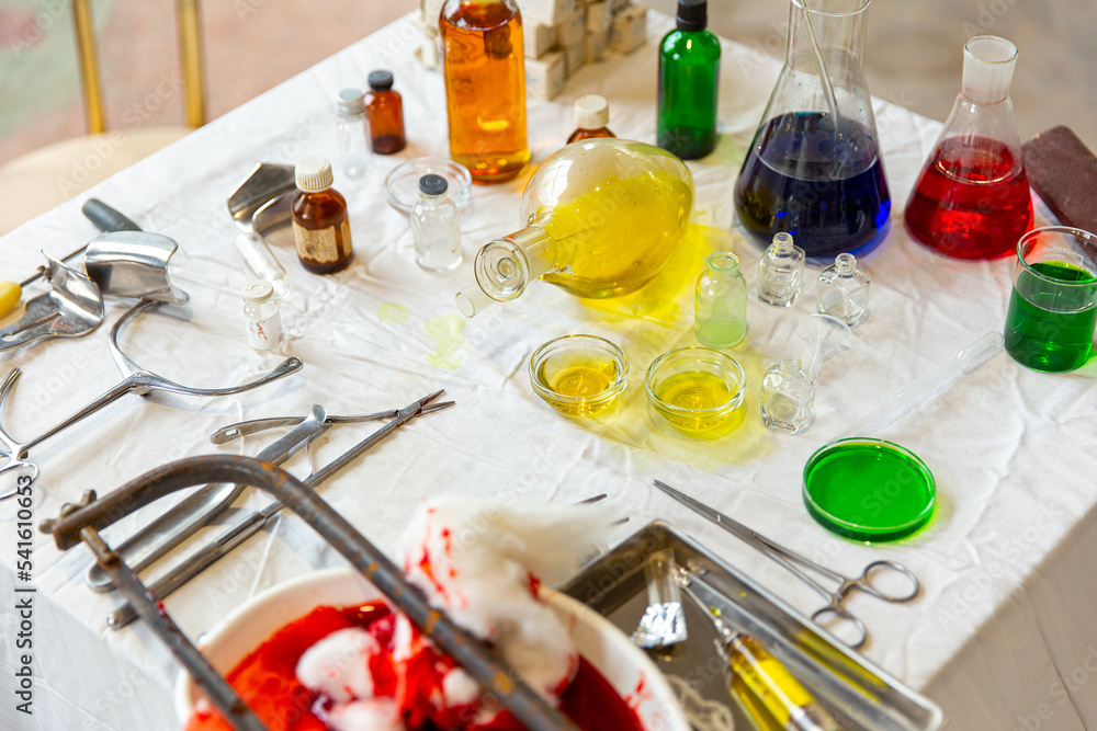 Rusty hacksaw, blood, medical cotton, syringe, medicines on the table. After amputation in the clinic Rusty hacksaw, blood, medical cotton, syringe, medicines on the table. After amputation in the clinic