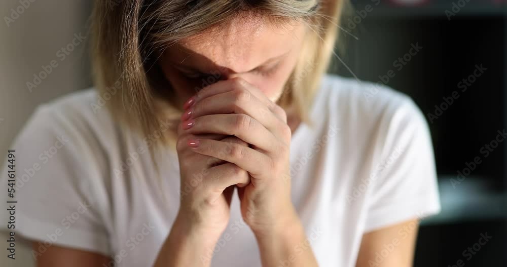 Unhappy young woman covering her face with hands feeling desperately betrayed Unhappy young woman covering her face with hands feeling desperately betrayed