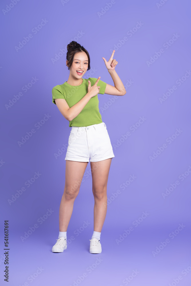 full body image of beautiful asian girl posing on pink background full body image of beautiful asian girl posing on pink background