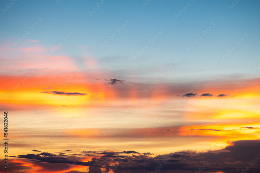 The dramatic colors of the sunset in the sky gradient from blue to orange.