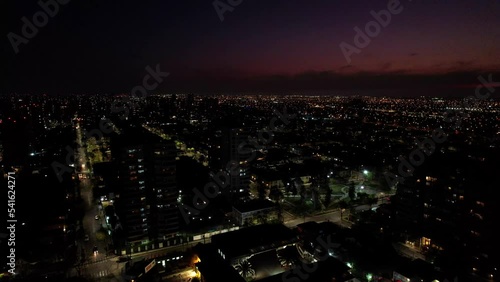 Wallpaper Mural Aerial view of a residential neighborhood at night with a sunset almost ending in the background, drone shot. Torontodigital.ca