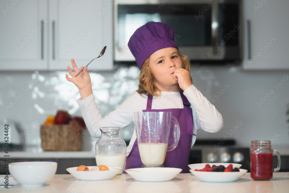 Chef child cooking healthy meal and dinner preparation. Little chef preparing healthy meal. Cute kid boy in chef uniform on kitchen. Chef child cooking healthy meal and dinner preparation. Little chef preparing healthy meal. Cute kid boy in chef uniform on kitchen.