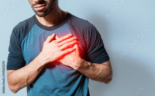 People with chest pain isolated, young man with tachycardia, man with heart pain on isolated background, young man with heart pain. Concept of people with heart problems photo