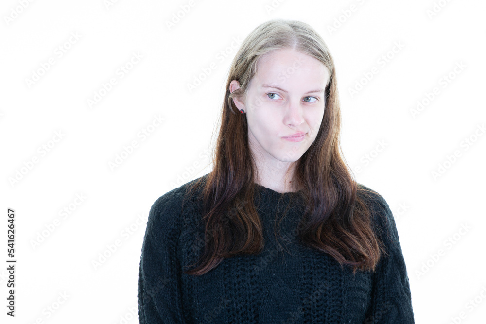 woman pouts grimacing with her mouth on white background