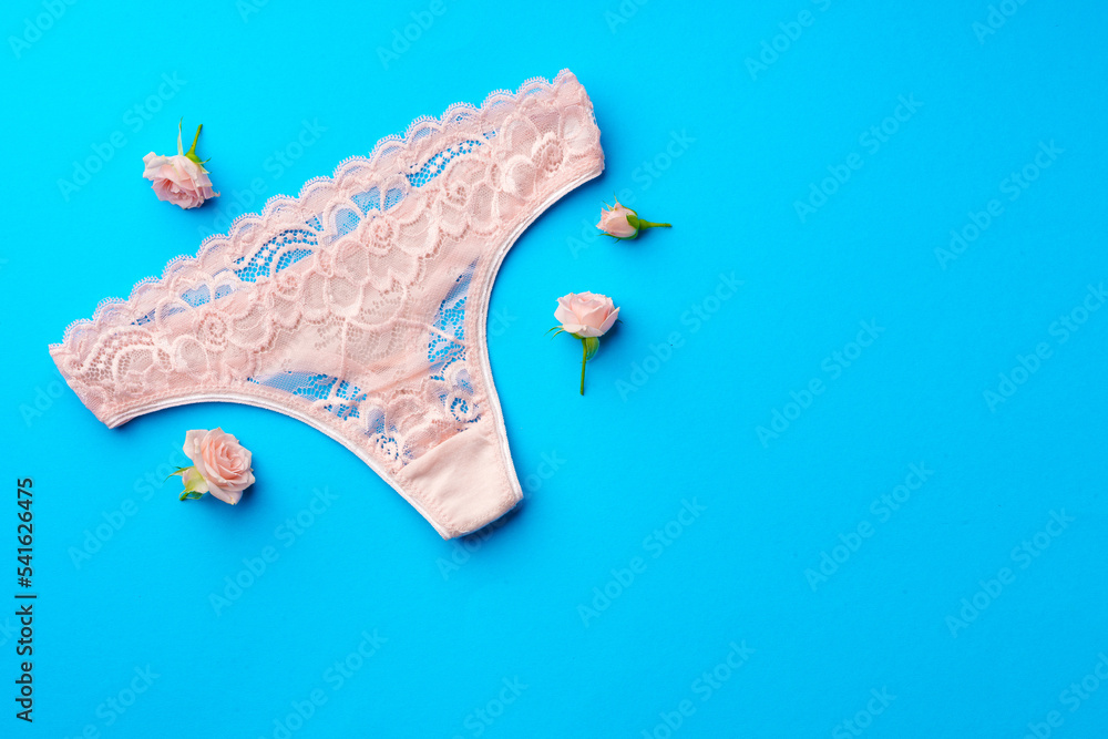 Women's panties with flower buds on paper background