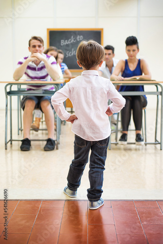 Little teacher in his classroom