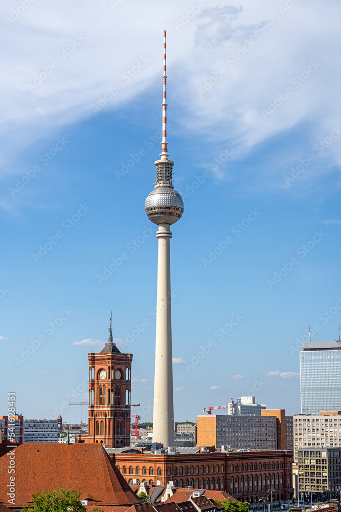 The famous TV Tower and the red town hall in Berlin on a beautiful sunny day