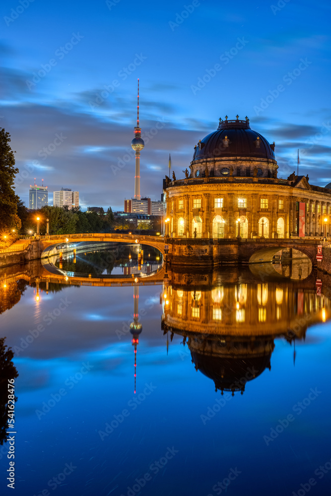 The Bode-Museum and the Television Tower reflected in the river Spree in Berlin at night