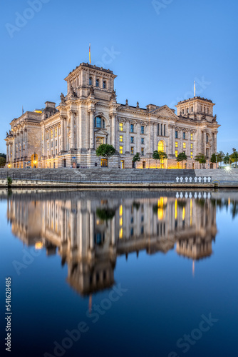 The Reichstag in Berlin at dawn reflected in the river Spree © elxeneize