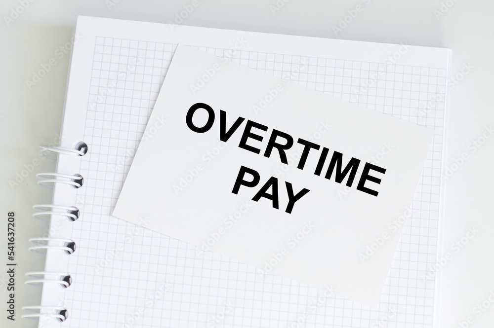 In the white sticker the text concept word overtime pay In the white sticker the text concept word overtime pay