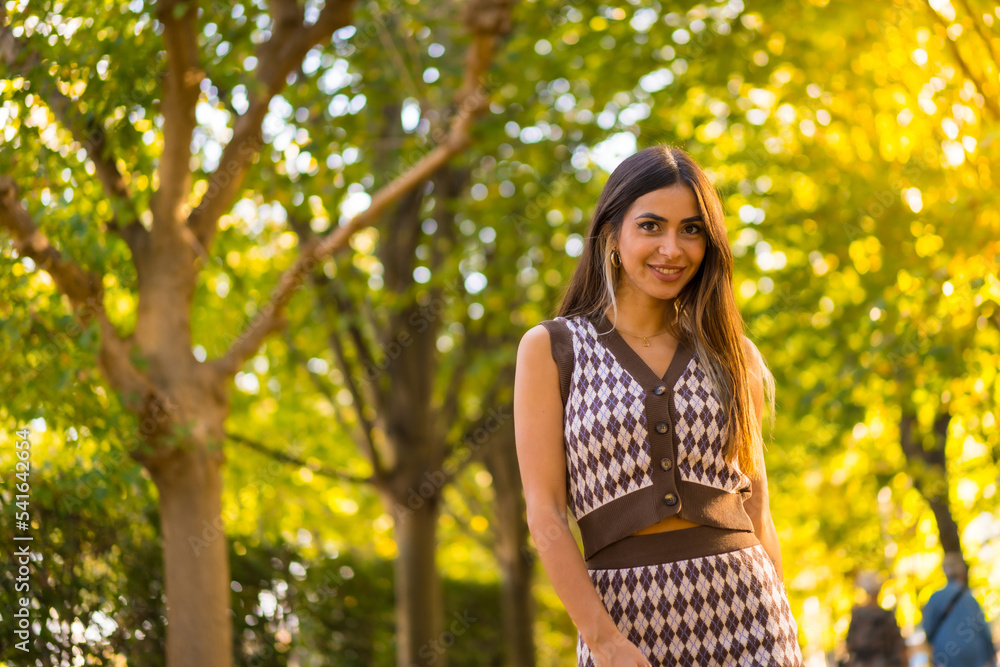 Portrait of a caucasian brunette woman in autumn in a natural city park, autumn lifestyle Portrait of a caucasian brunette woman in autumn in a natural city park, autumn lifestyle