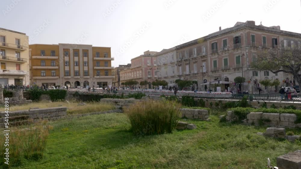 Ortygia Island, Syracuse, Italy, 05-04-2022. Famous Temple of Apollo (Apollonion) in the center of Ortigia island. City of Syracuse. Panning 4K Ortygia Island, Syracuse, Italy, 05-04-2022. Famous Temple of Apollo (Apollonion) in the center of Ortigia island. City of Syracuse. Panning 4K