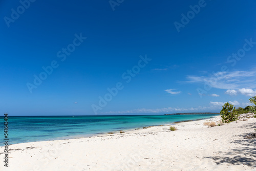 Pristine white sands and crystal clear waters of the Playa de la Cueva Beach, Cabo Rojo, Pedernales, Dominican Republic. Vibrant colors, amazing sea near the border with Haiti. © laura