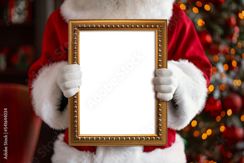 Santa Claus holding white frame in his hands photo