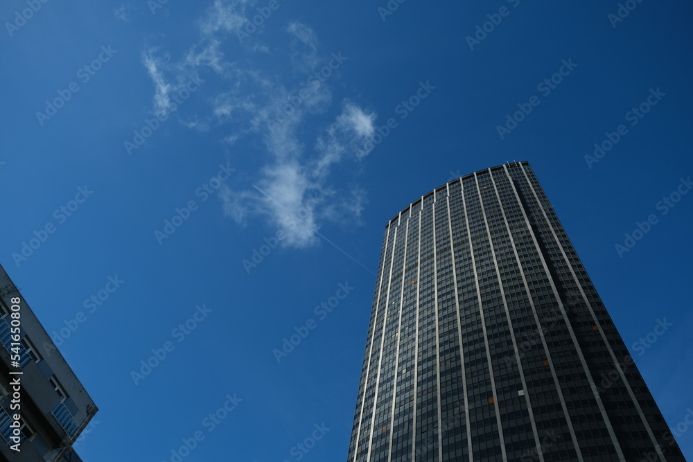Paris, France - 2022 : Tour Montparnasse tower, and airplan Paris, France - 2022 : Tour Montparnasse tower, and airplan