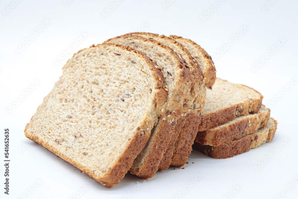 sliced ​​wholemeal bread, on white background. Concept of healthy food, balanced breakfasts, fiber foods.